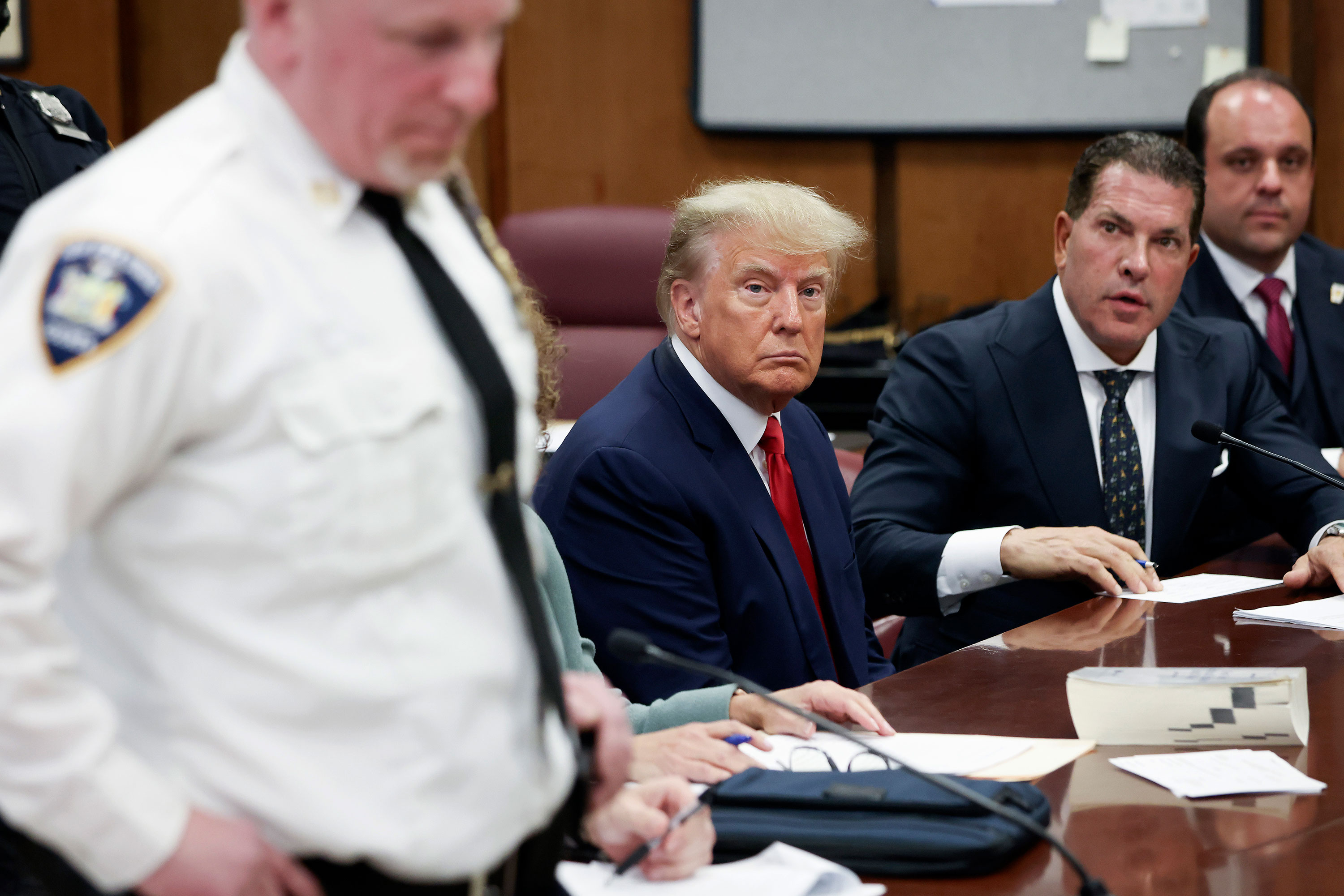 Former President Donald Trump sits with his attorneys during his arraignment at the Manhattan Criminal Court in New York on April 4. Trump pleaded not guilty to 34 felony counts stemming from hush money payments made to adult film star Stormy Daniels.